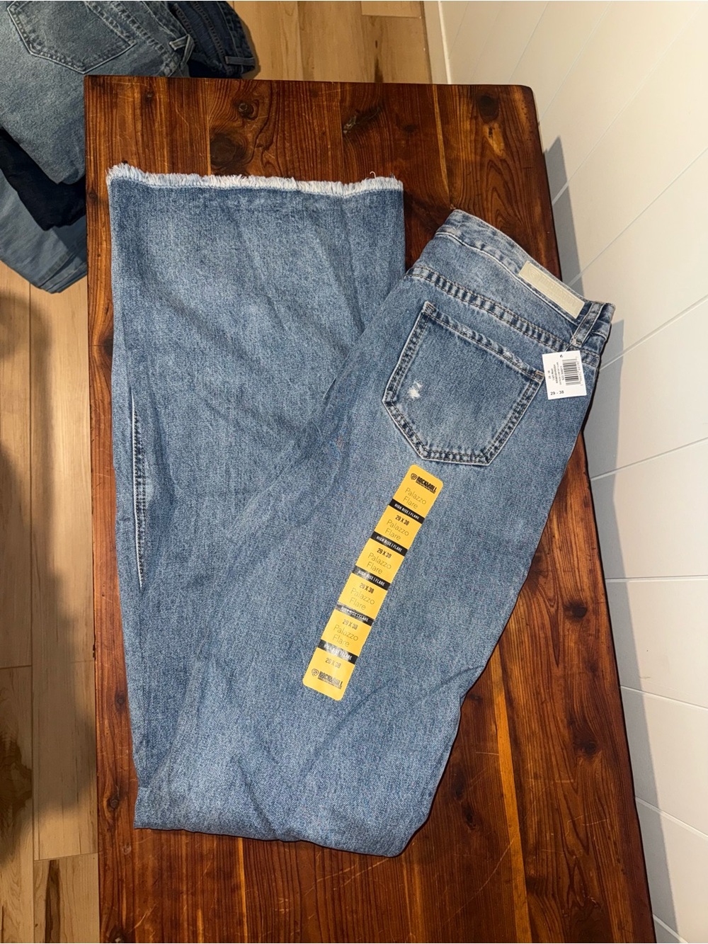 High-Rise Light Blue Wide-Leg Jeans with Frayed Hem